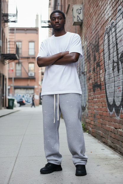 Male model wearing Paint Splatter Baggy Sweatpant in urban streetwear setting