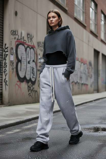 Female model wearing Paint Splatter Baggy Sweatpant in urban streetwear setting